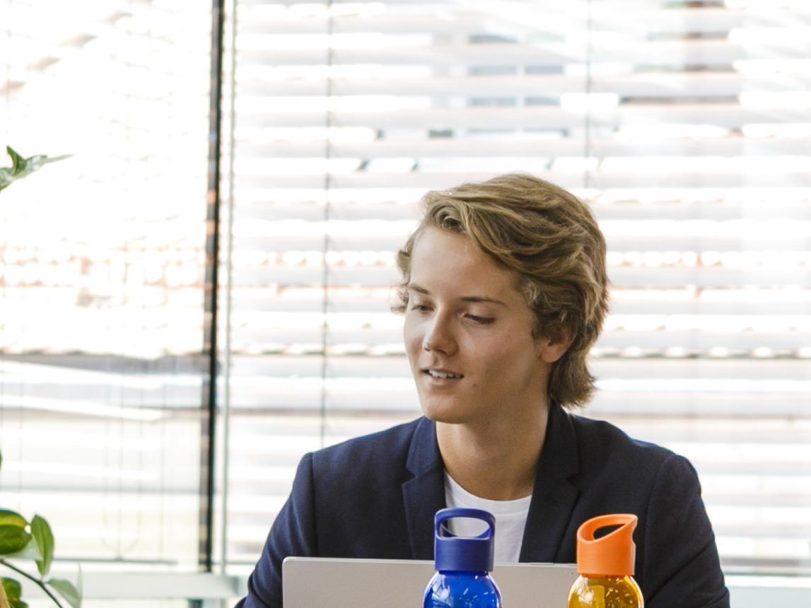 A student sitting in front of his notebook